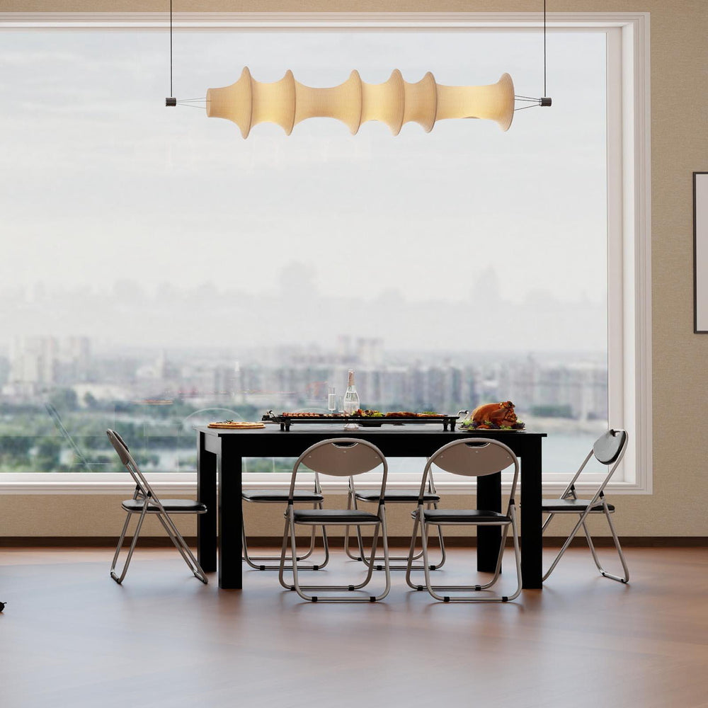 Compact dining set with a large table, six folding chairs, and a rolling cart for efficient storage in modern living.