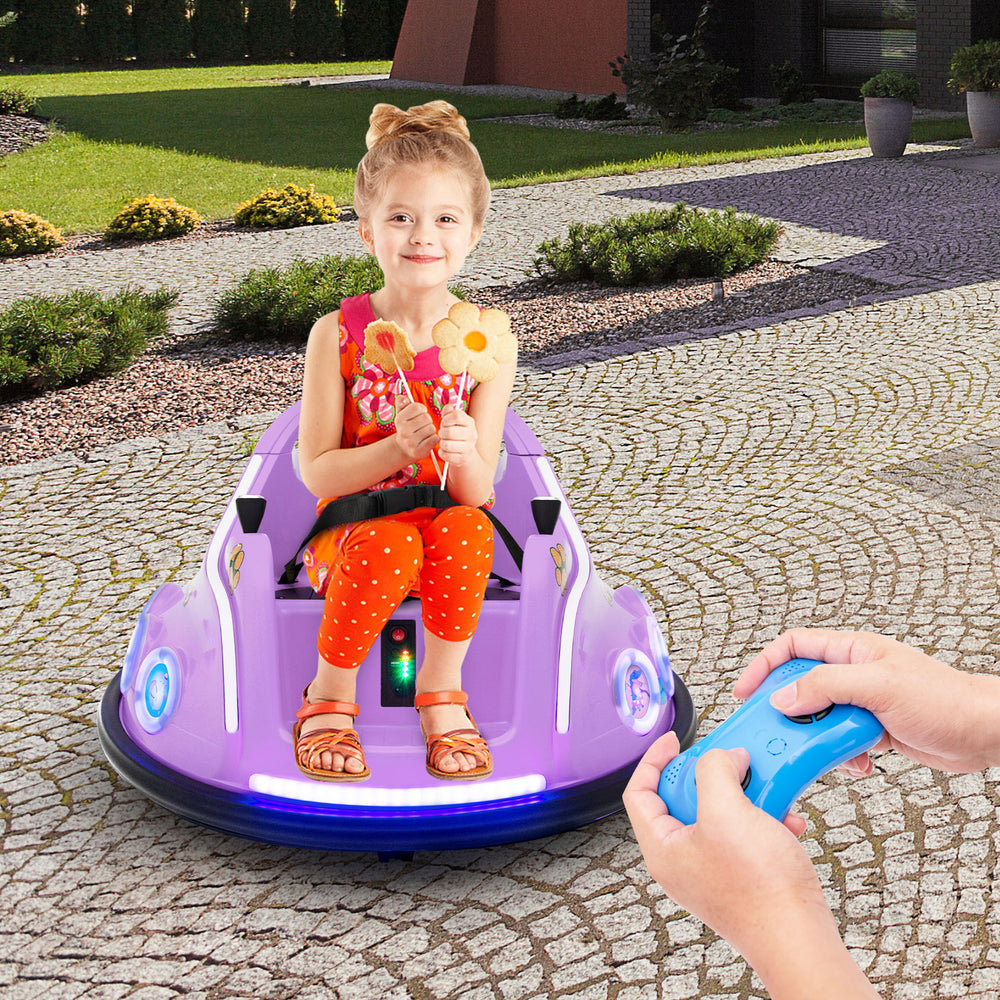 Close-up of the purple 12V electric ride-on car's front LED lights and joystick, highlighting safety and entertainment.