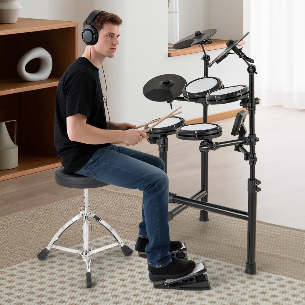 Electric drum set with adjustable stool, featuring double-layer mesh pads and USB MIDI for silent practice and easy.