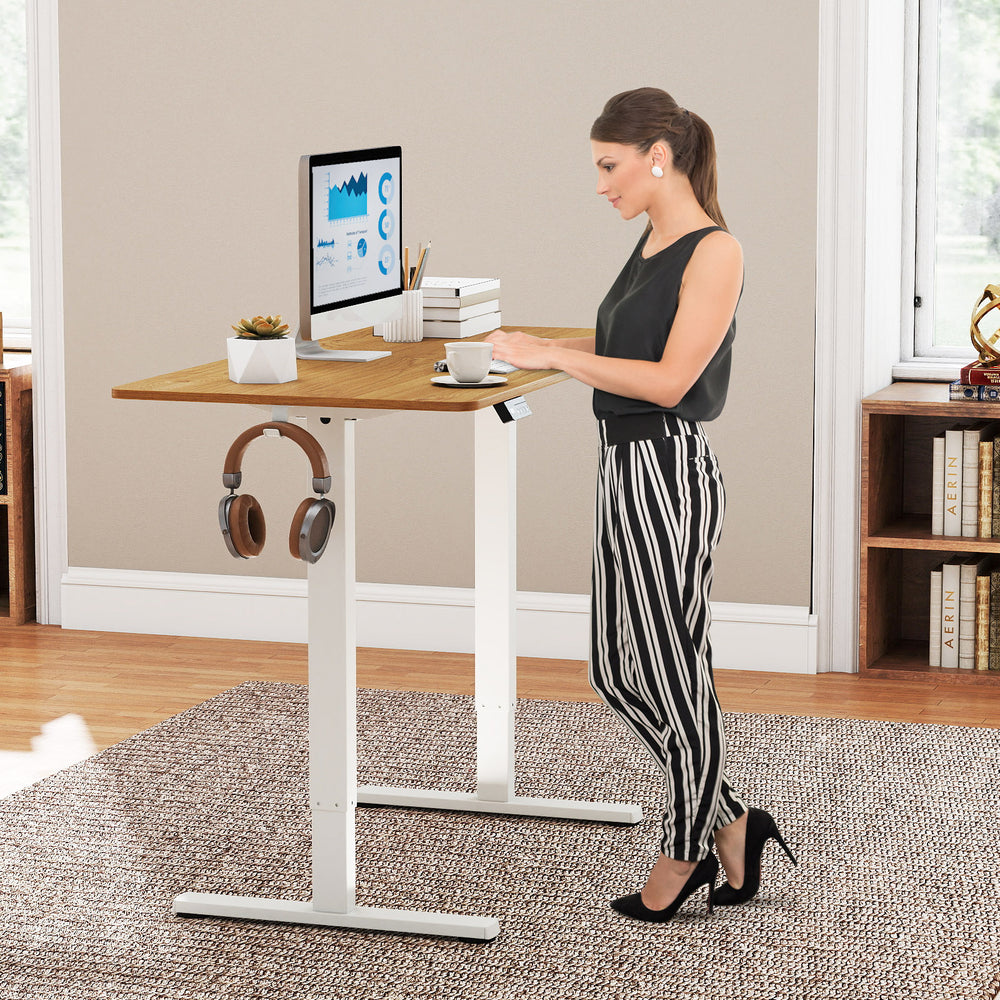 Height adjustable electric standing desk with LED display, ergonomic design, and convenient hanging hook for easy.