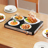Electric warming tray with adjustable temperature control, holding various dishes, ideal for buffets and gatherings.
