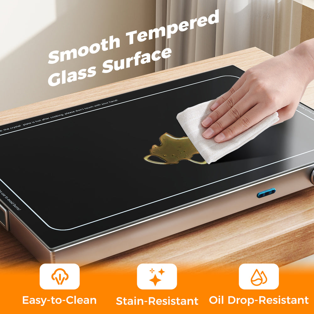 Electric warming tray with a smooth tempered glass surface, easy-to-clean and stain-resistant, ideal for buffets and.