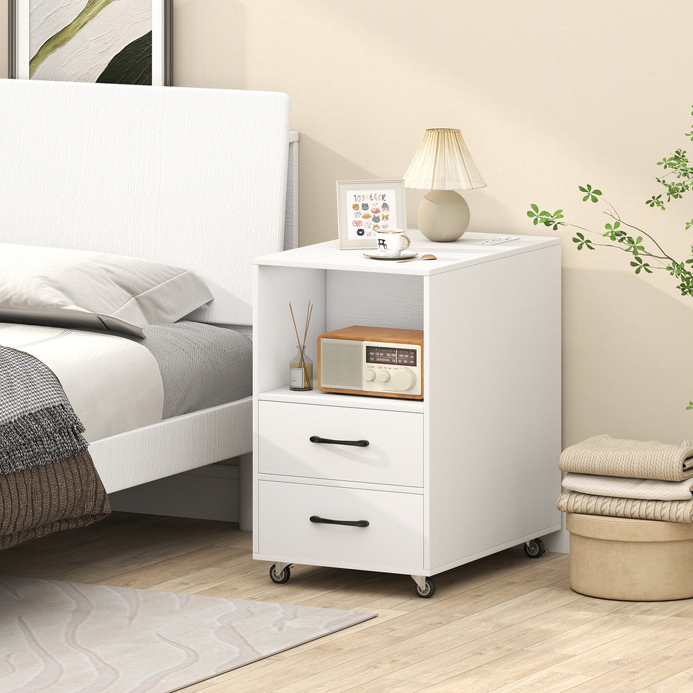 White end table on wheels with charging station, two drawers, and open shelves for versatile bedside storage.