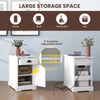 End table with charging station, featuring a flip top, drawer, and adjustable shelf for convenient storage in white.