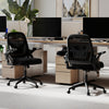 Ergonomic black computer desk chair with lumbar support and flip-up arms, designed for comfort and mobility in office.