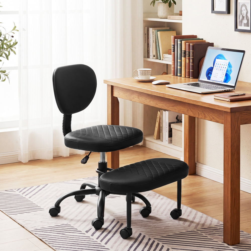 Ergonomic black office chair featuring a sturdy 5-claw base and rolling wheels, perfect for flexible movement in any.