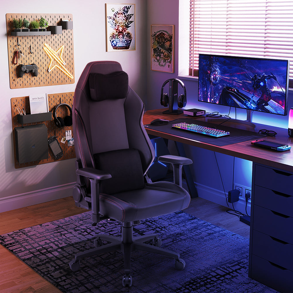 Ergonomic high back computer chair in black with adjustable headrest and lumbar pillow for optimal comfort and support.