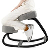 Wooden ergonomic backless rocking kneeling chair with gray cushioned seat, promoting active sitting and comfort.