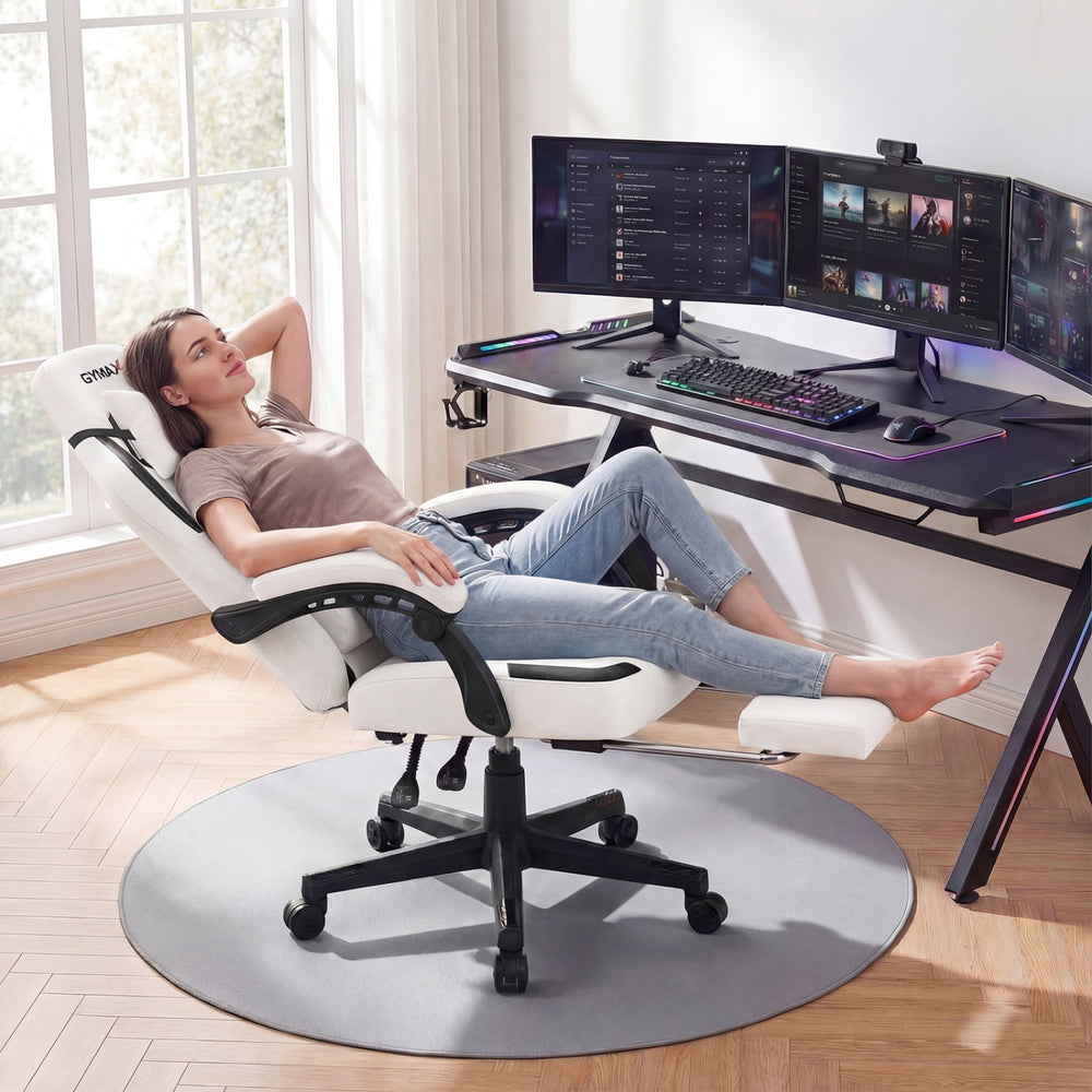 Ergonomic gray video game chair with headrest, reclining backrest, and retractable footrest for home office comfort.