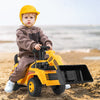 Child riding a yellow excavator digger toy with adjustable bucket on the beach, promoting outdoor play and physical.