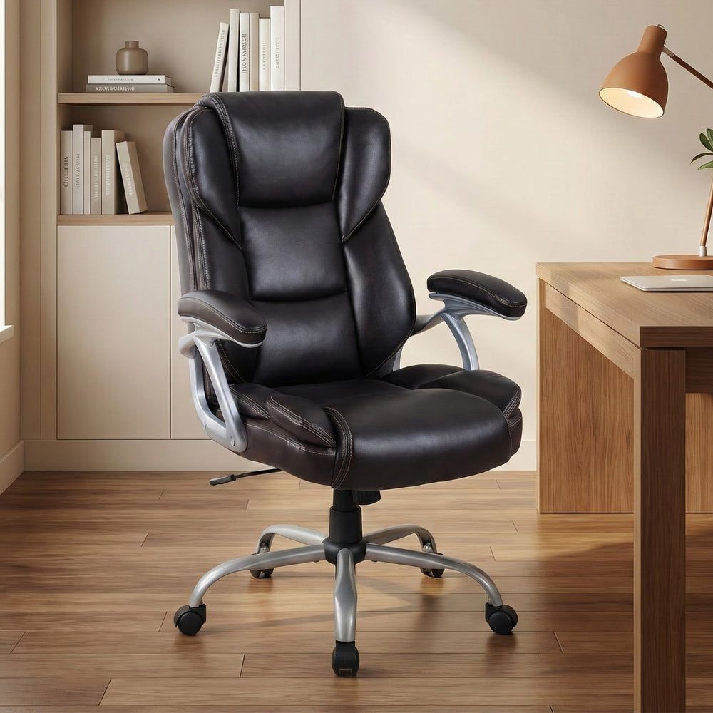 Brown ergonomic executive office chair with padded seat and armrests, adjustable backrest, and 360° swivel for comfort.