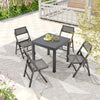 Expandable grey patio dining table for 4-6 people with slatted top, set in an outdoor setting with folding chairs.