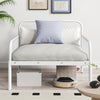 White extendable metal daybed with guardrails and armrests, perfect for relaxation and extra sleeping space.