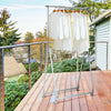 Extendable foldable heavy-duty clothing rack with adjustable height, featuring a stable triangular base and wheels for.