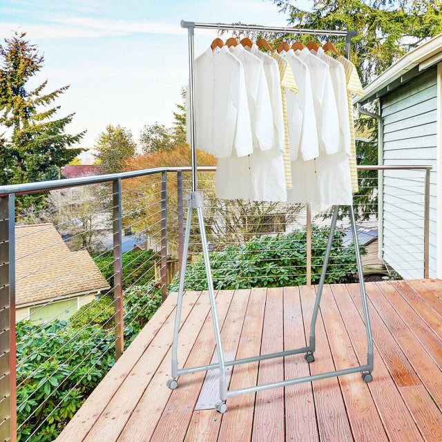 Extendable foldable heavy-duty clothing rack with adjustable height, featuring a stable triangular base and wheels for.