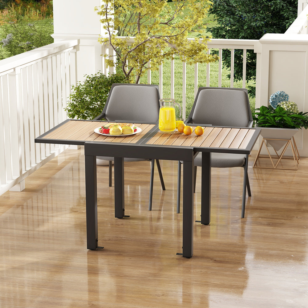 Extendable patio table in natural finish, accommodating 4-6 people, with a slatted wood-like top and sturdy aluminum.