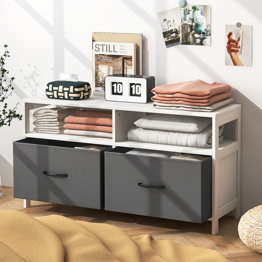White fabric chest of drawers featuring 2 large storage drawers and 2 open shelves, ideal for versatile home.