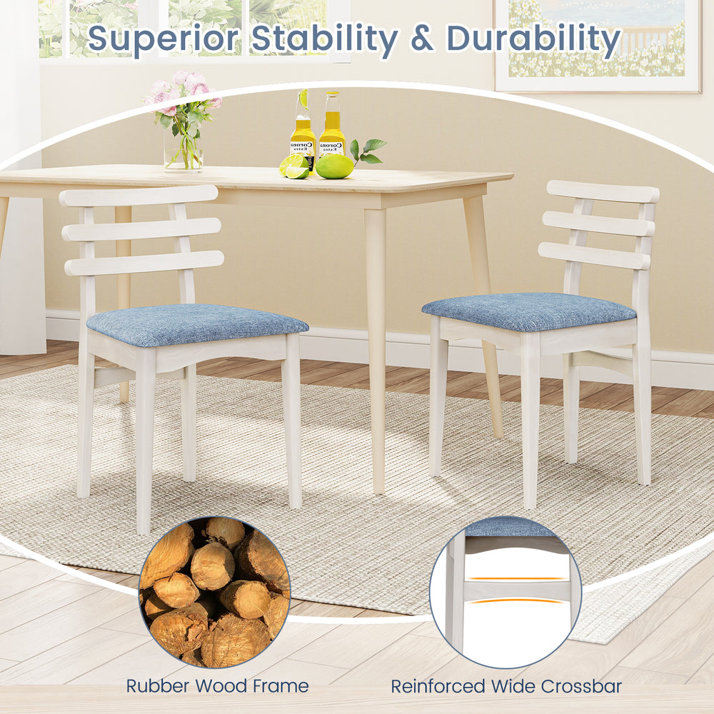 White fabric kitchen side chairs with rubber wood frame and padded seat, ideal for dining or study use.