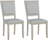 Set of 2 grey farmhouse dining chairs with fabric upholstery and vintage nailheads, perfect for rustic dining areas.