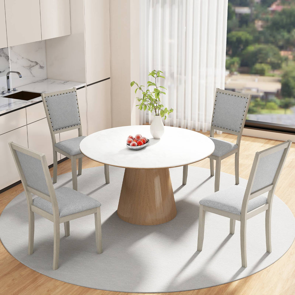 Grey fabric upholstered dining chairs with rubber wood frame, featuring vintage nailheads, ideal for rustic dining.
