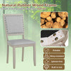 Farmhouse dining chair with grey fabric upholstery, rubber wood frame, and vintage nailheads for elegant dining decor.