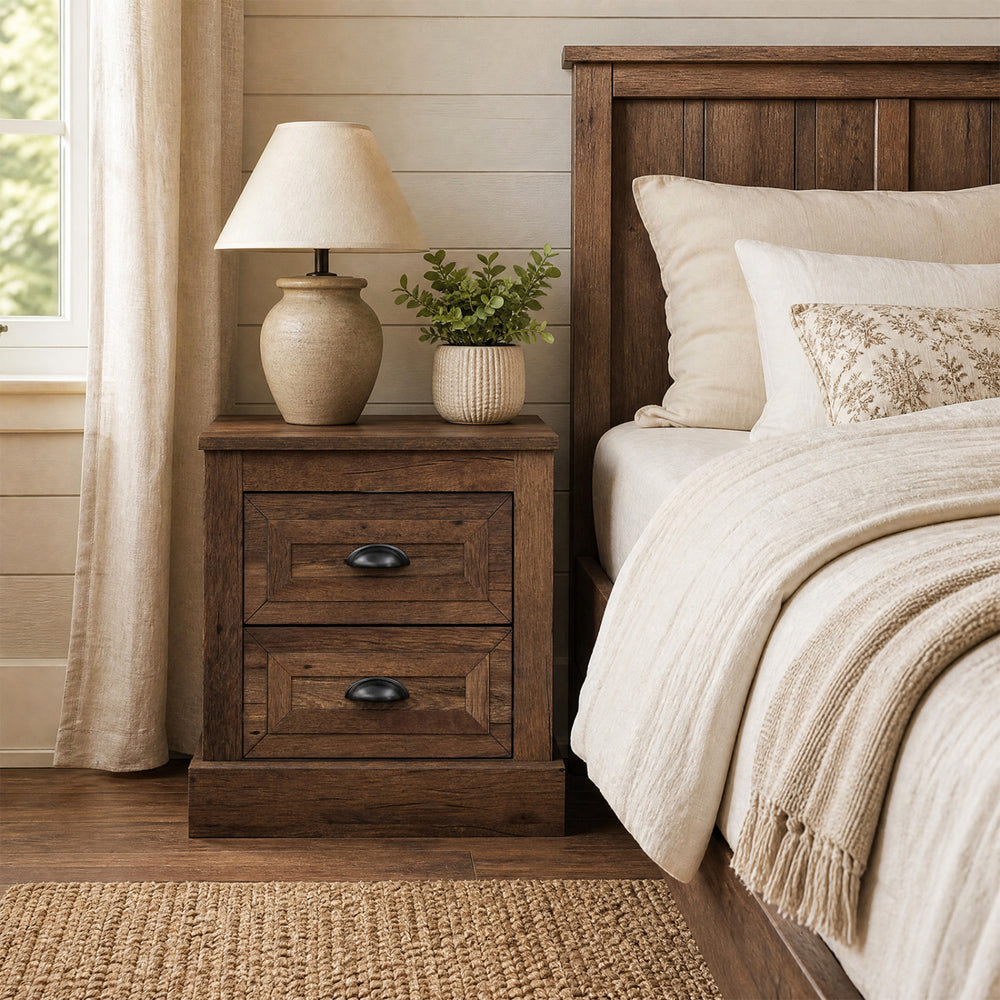 Brown farmhouse nightstand with two drawers, vintage handles, and a wood grain finish, ideal for bedside storage.