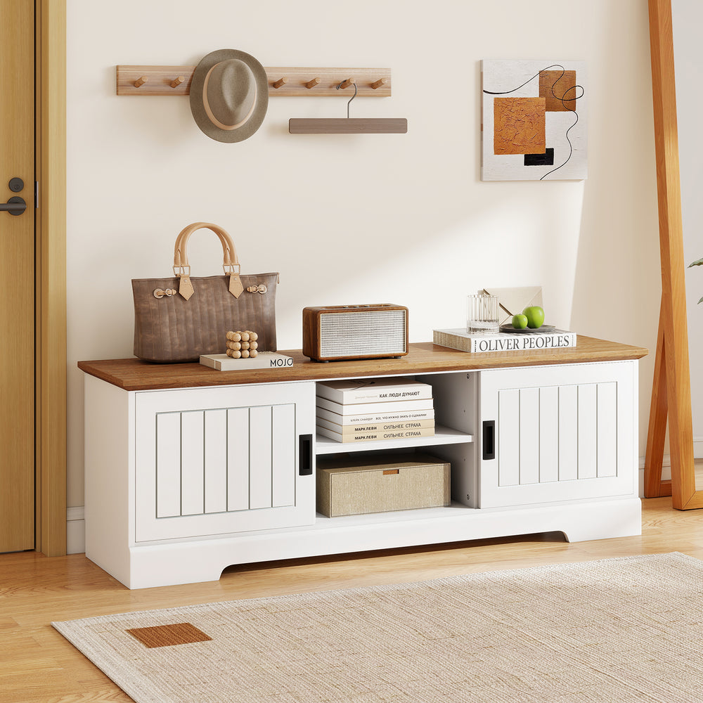 Farmhouse TV stand in white with sliding doors, spacious top for 65" TVs, and adjustable shelves for versatile storage.