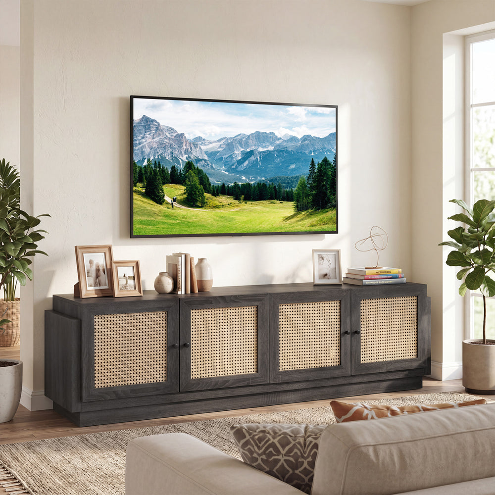 Farmhouse TV stand with black finish showcases exquisite PE rattan doors and a wide top for accommodating 75-inch TVs.