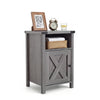 Farmhouse wooden nightstand with barn door, open shelf, and cabinet for stylish storage in bedroom or living room.