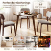 Round walnut dining table for 4, featuring a 35.5" diameter and rubber wood legs, perfect for cozy gatherings.