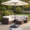 Heavy-duty 90 lbs fillable umbrella base in black with wheels for easy repositioning, designed for patio tables.