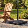 Fillable umbrella base with wheels, 90 lbs heavy duty, designed for stability with patio umbrellas in outdoor settings.