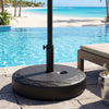 Heavy-duty black fillable umbrella base for 1.2"-2" poles, designed for stability by the poolside.