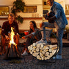Heavy-duty 20-inch round metal log rack with curved design, neatly storing firewood for camping and outdoor gatherings.