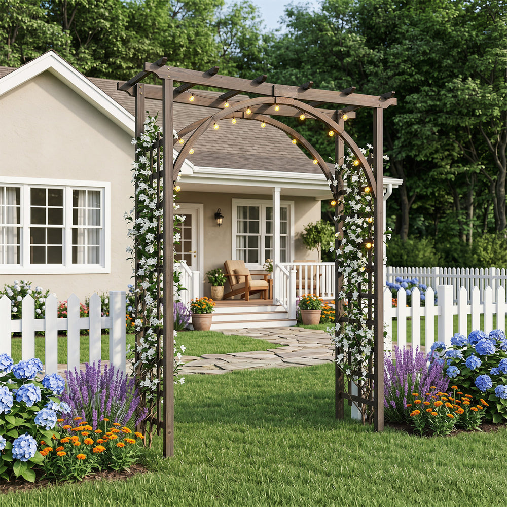 Flat top garden arch trellis in brown, 85" tall, designed for climbing plants and wedding decor in a lush garden.