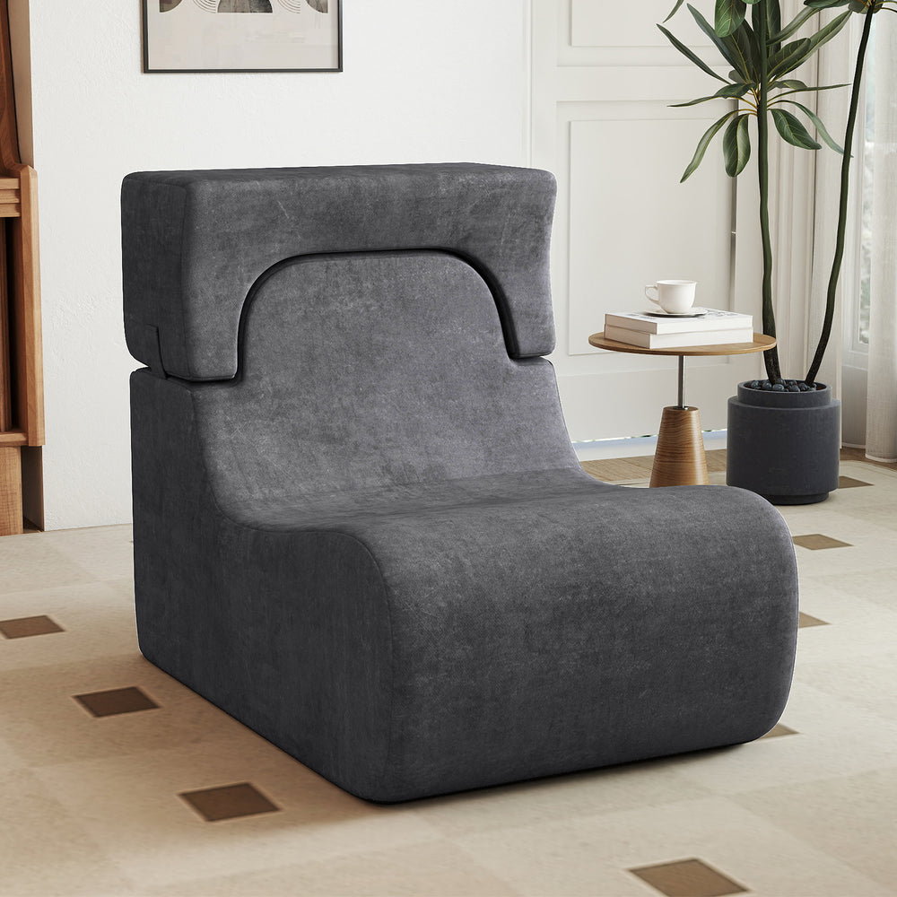 Curved gray floor chair with detachable headrest, made of ice velvet fabric, perfect for relaxing or reading.