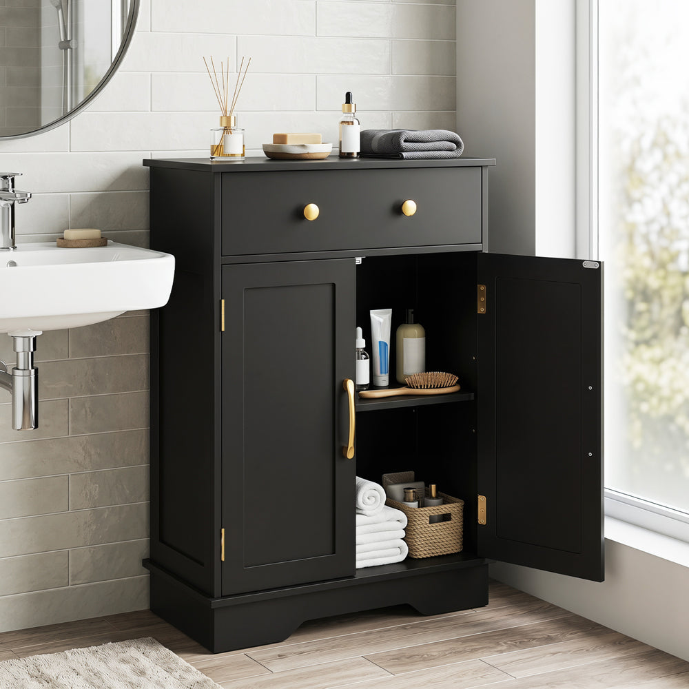 Black floor storage cabinet with doors, drawer, and adjustable shelf for organized bathroom essentials and modern decor.