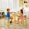 Flower-shaped children table set with two colorful chairs, perfect for playtime and activities in a playroom or daycare.