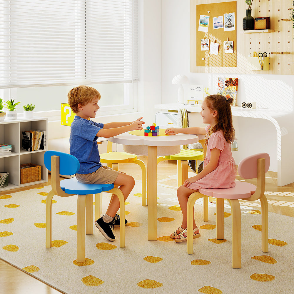 Flower-shaped children table set with two colorful chairs, perfect for playtime and activities in a playroom or daycare.