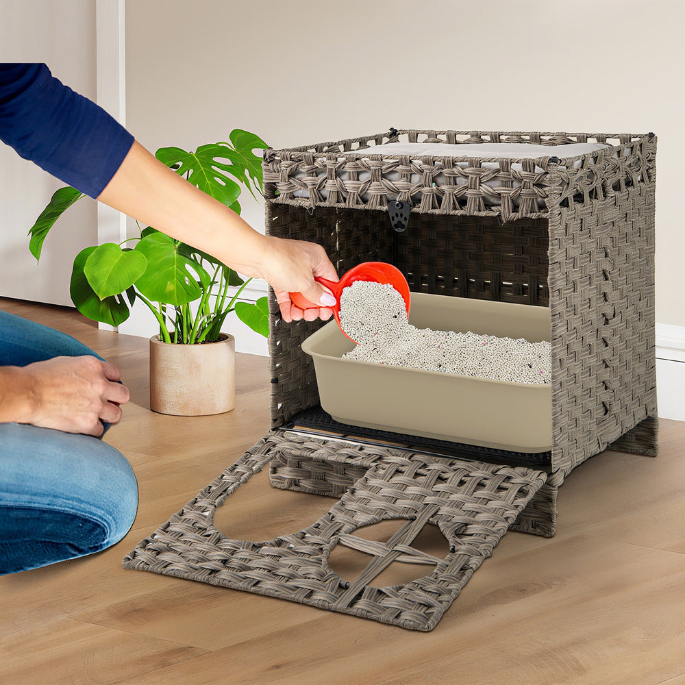 Foldable grey rattan cat litter box enclosure with large entry, litter mat, and removable cushion for easy access and.
