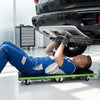 Foldable automotive creeper with thick padded cushion and 360° swivel wheels for easy under-car access and comfort.