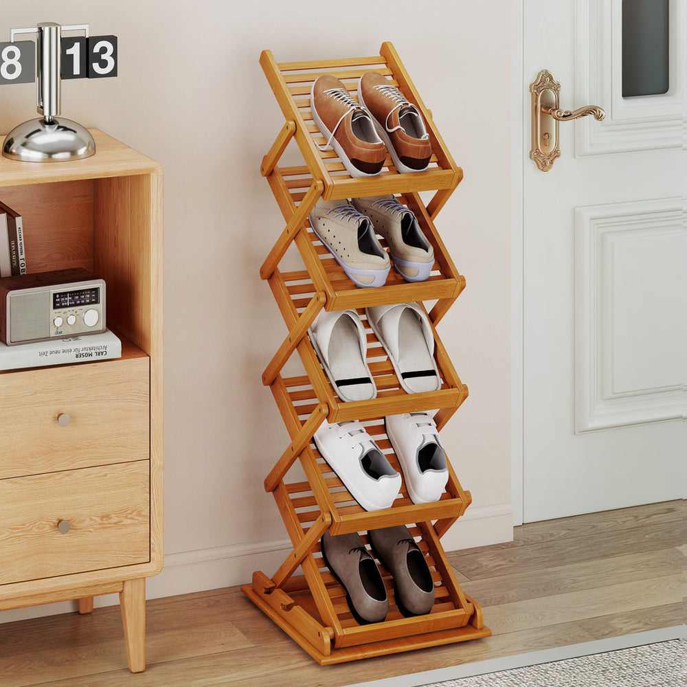 Foldable bamboo magazine rack with 5-tier inclined shelves and 2 adjustable positions for versatile storage solutions.
