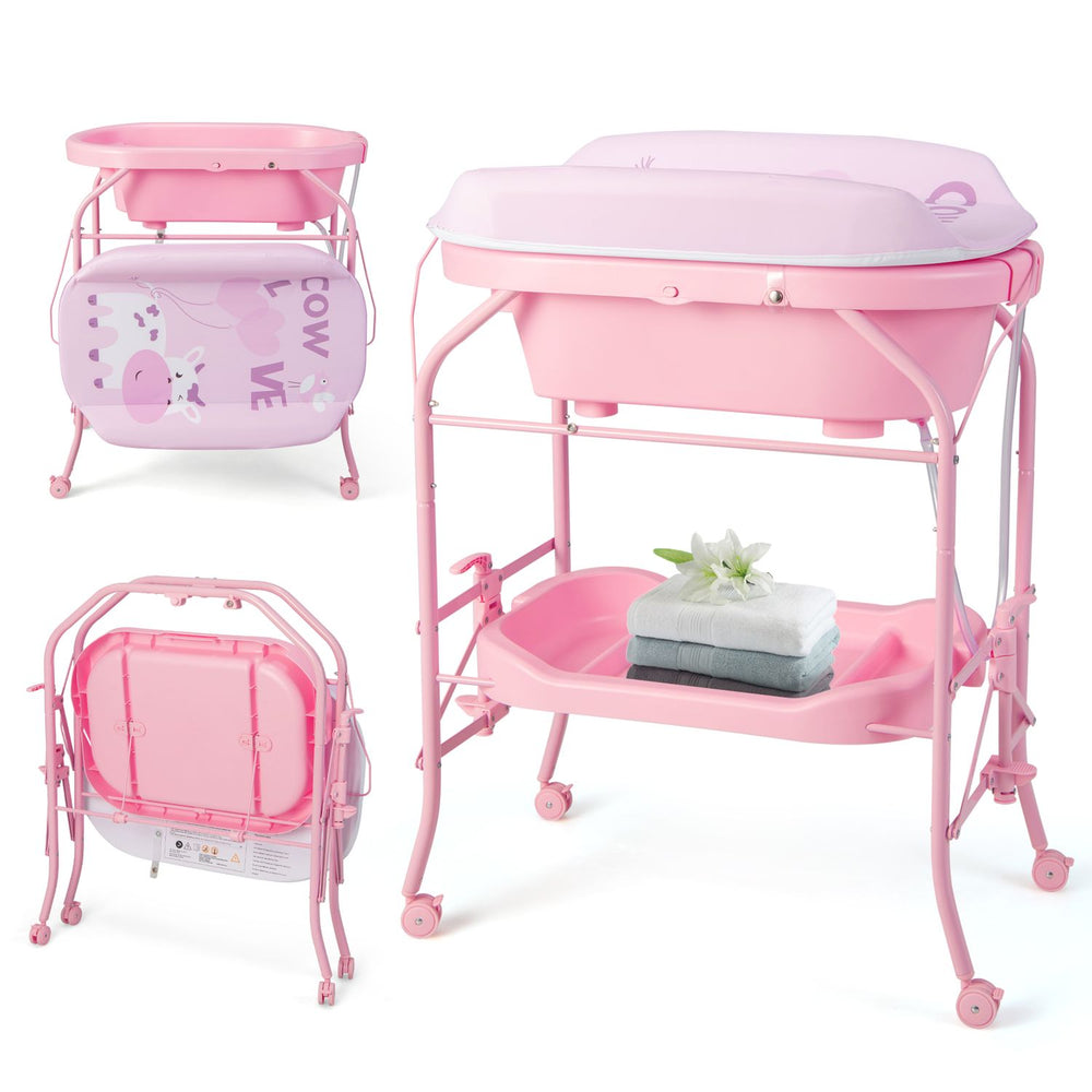 Foldable pink diaper changing table on wheels with bathtub, shown with changing pad, storage shelf, and baby supplies.