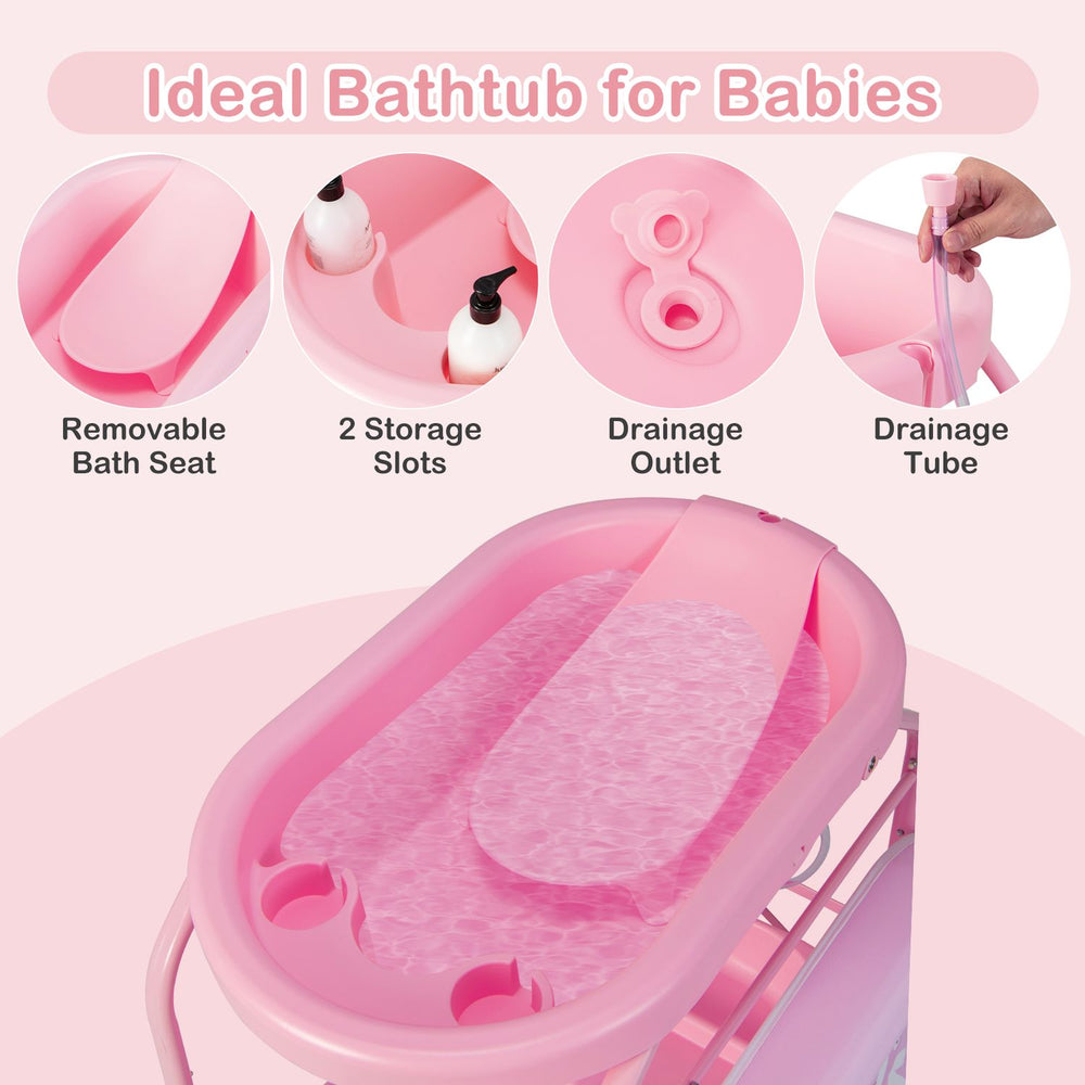 Pink foldable diaper changing table with bathtub on wheels, shown with removable bath seat and drainage tube for infants.