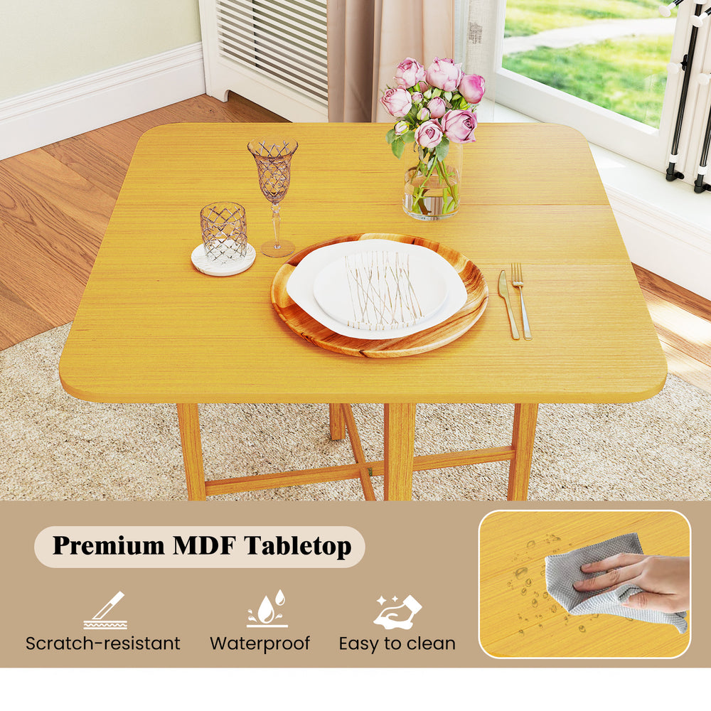 Foldable dining table with natural MDF tabletop, rubber wood legs, and rustic wood grain, perfect for small spaces.