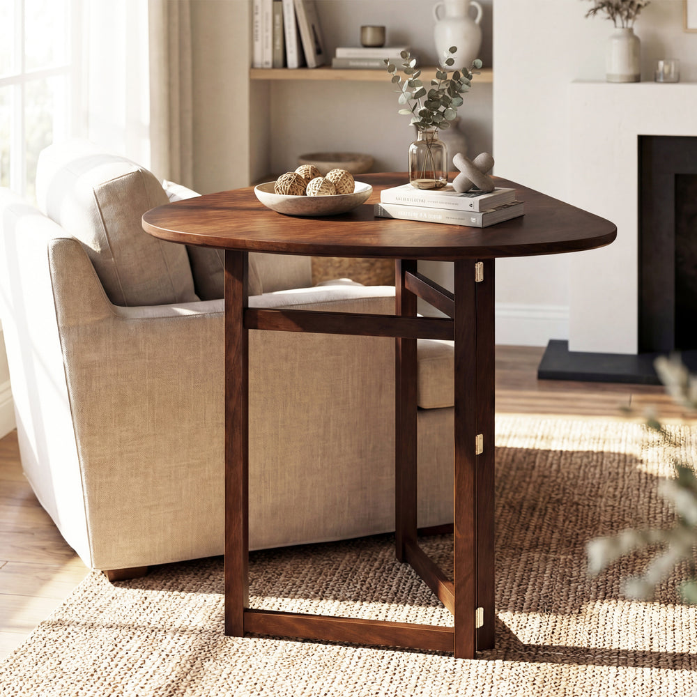 Triangular foldable dining table in walnut finish, perfect for small spaces, ideal for two with rounded corners for.