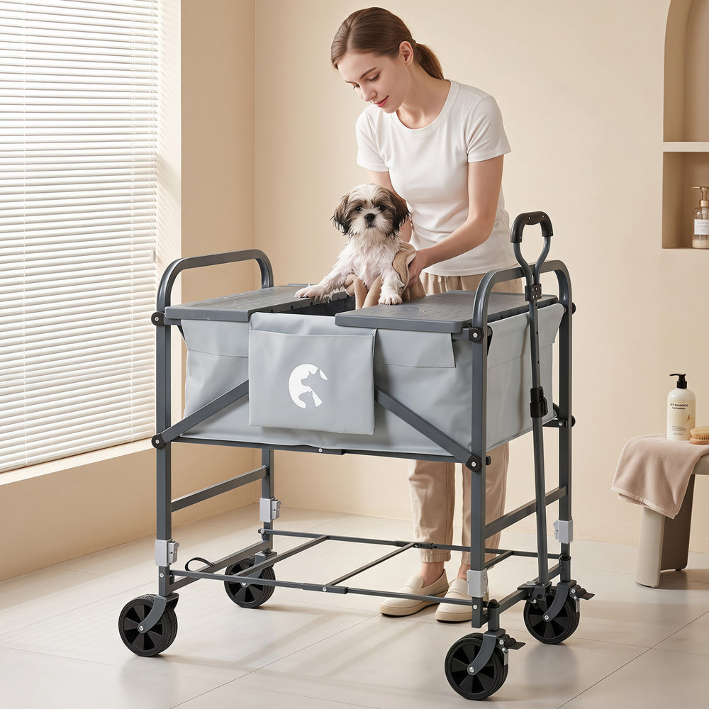 Foldable gray dog bath cart with adjustable height, 4 wheels, and detachable care board for easy pet grooming.