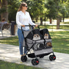Foldable double pet stroller in gray with adjustable sunshade, safety leash, and storage basket for multiple pets.