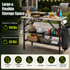 Foldable outdoor cook station with stainless steel top, removable shelves, and trash bag holder for camping convenience.