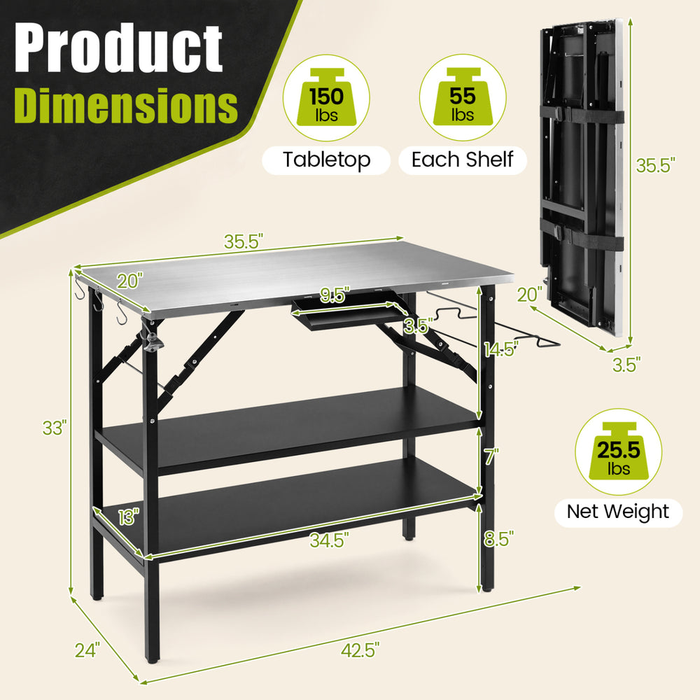 Foldable outdoor cook station in black features a stainless steel top, removable shelves, and a trash bag holder for camping.